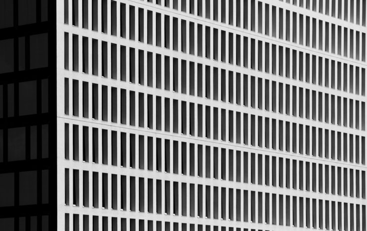 a tall building with a clock on the side of it